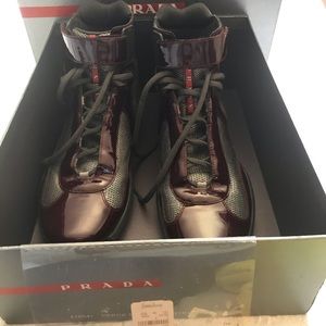 Authentic high top patent leather Prada sneakers.